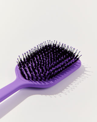 Purple hair brush